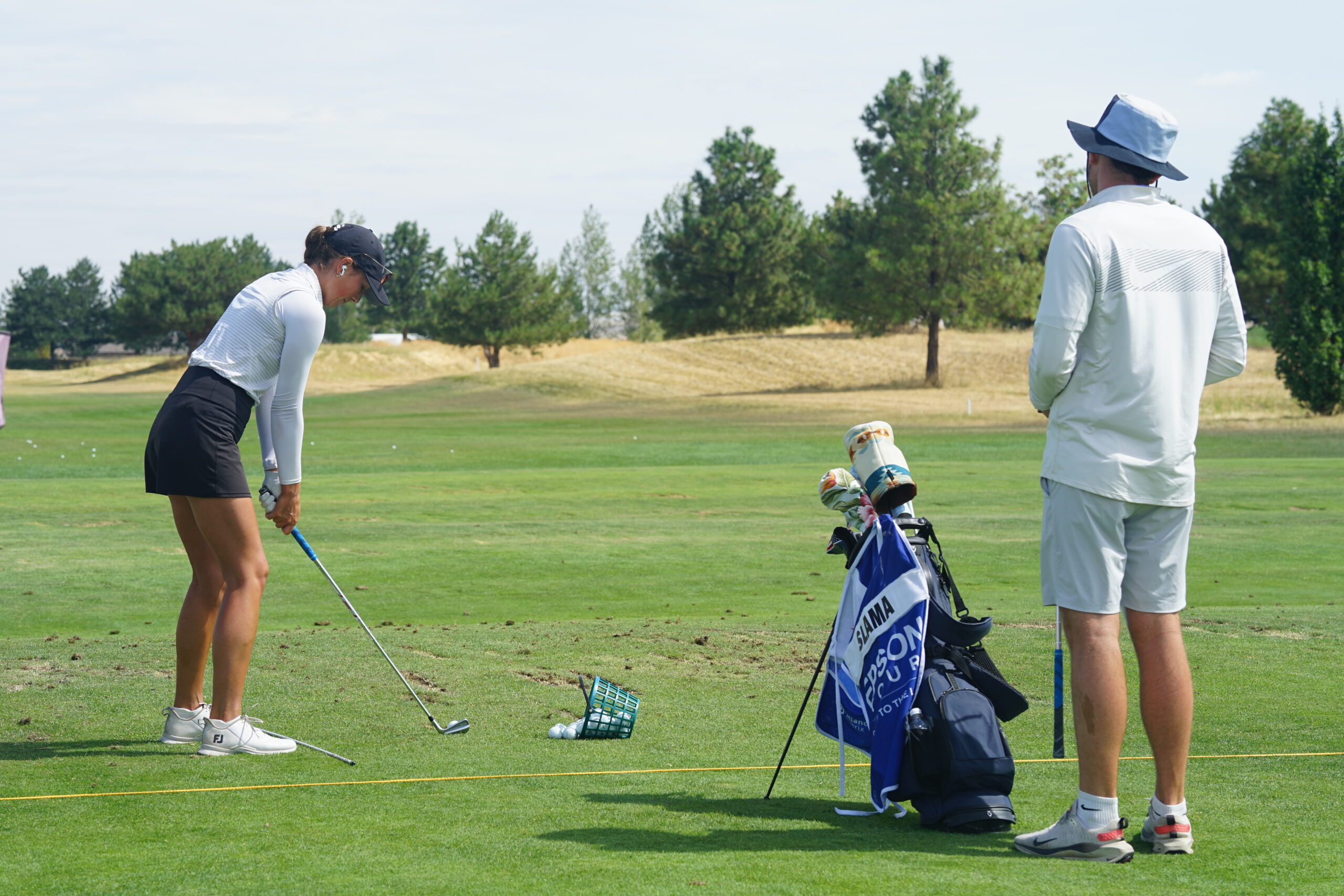 Ellie and Tim on the driving range